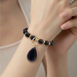 Blue stone gemstone charm. Lava bead diffuser bracelet.